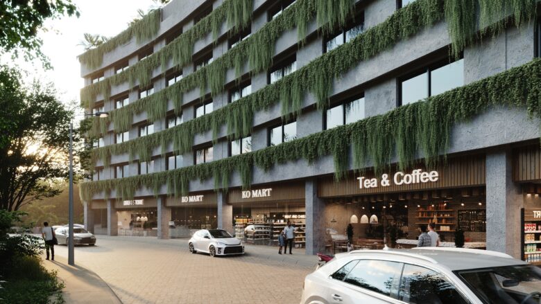 Fachada principal de Macondo Tulum con vegetación colgante, locales comerciales como cafetería y supermercado, diseño arquitectónico orgánico rodeado de naturaleza, parte de los departamentos en venta en Tulum.