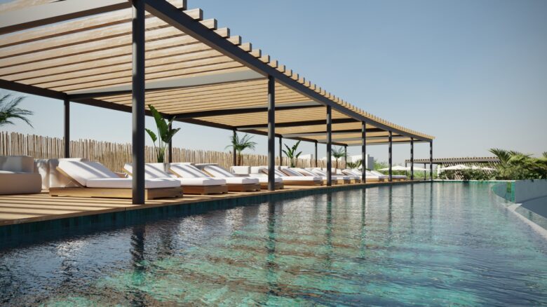 Rooftop de Macondo Tulum con alberca infinity, camastros de diseño contemporáneo bajo pérgolas de madera y vegetación tropical, en un entorno relajante dentro de los departamentos en venta en Tulum.